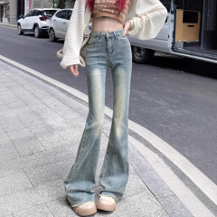 ギャルの復古はやせているジーパンの女性の春の小さい大衆のズボンの小さいラッパのズボンのストレートなズボンの地面を引きずって明るい色のズボン