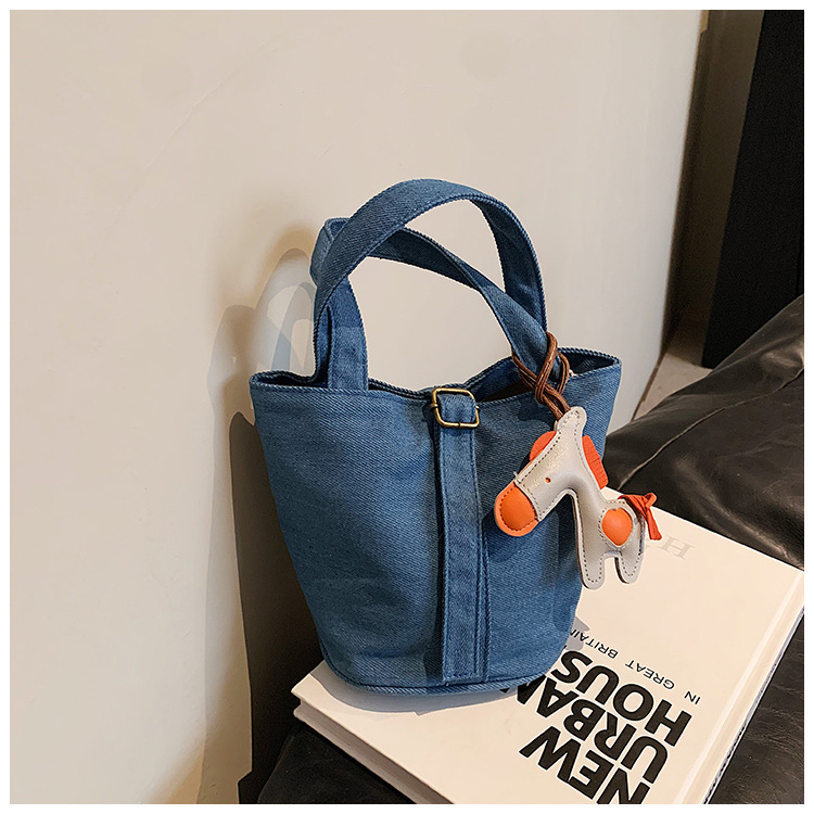 Bolso de mezclilla lindo de los niños de las mujeres 2023 Otoño Nuevo estilo coreano bolso de cubo de tela de color sólido para niños