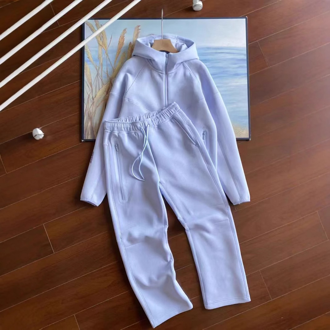 25 años primavera y otoño nuevo estilo casual deportes capa de aire chaqueta con capucha y pantalones trajes 454 y 461