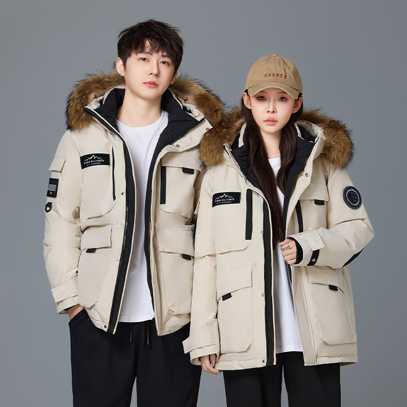 Invierno transfronterizo nueva chaqueta de plumón hombre y mujer largo al aire libre frío extremo engrosado pareja superando la chaqueta de trabajo