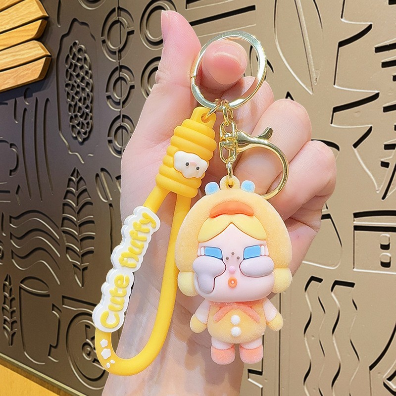 Muñeca de dibujos animados goteo llavero bolsas escolares exquisitas para hombres y mujeres colgantes para agarrar muñecas colgantes para el mercado nocturno regalos al por mayor