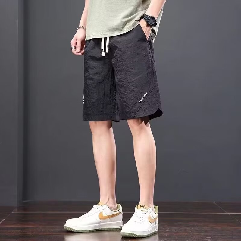 Camisas, menos ropa, pantalones de verano de cinco puntos, holgados y cómodos, todo-fósforo, pantalones casuales de estilo de Hong Kong, deportes para hombres, hombres estadounidenses, de secado rápido