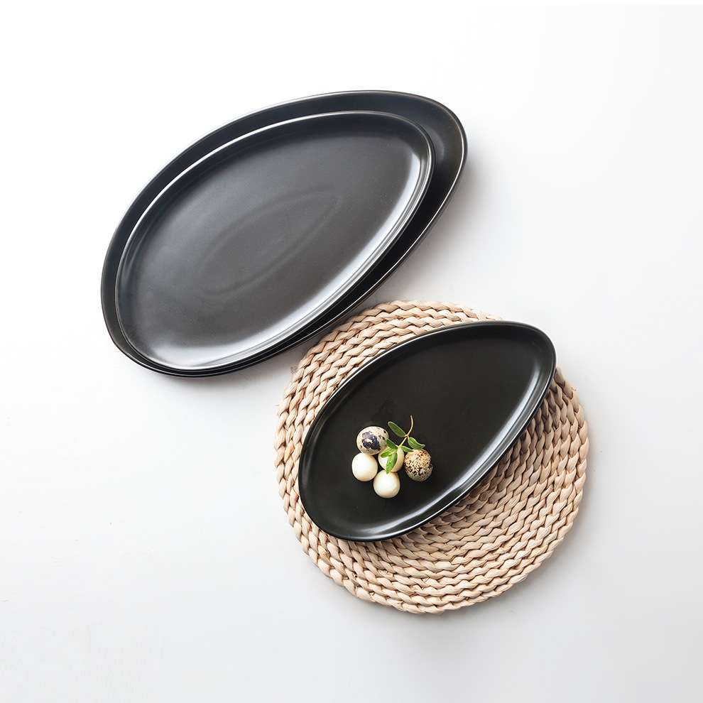 工厂现货日式餐具特色餐厅酒店小吃配菜盘哑光黑白陶瓷蛋形浅盘