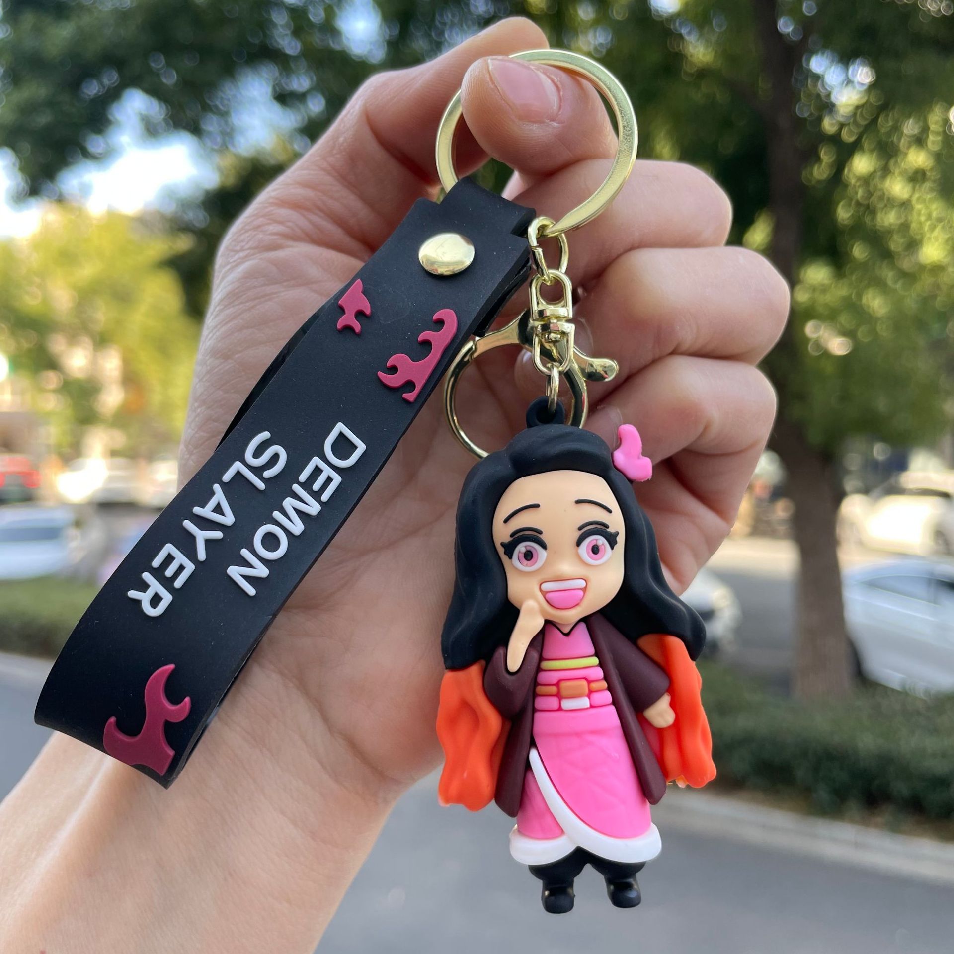 鬼滅の刃の鍵は自動車のキーチェーンの漫画の公仔のかばんのペンダントの子供機の小さい贈り物の卸売りを掛けます。