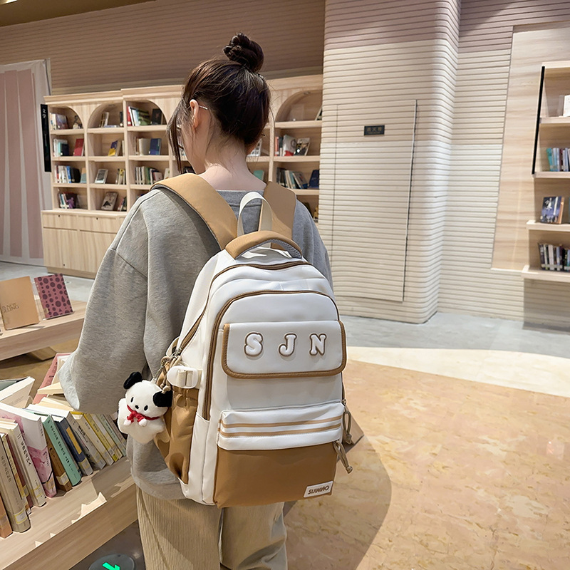 Nueva mochila escolar de gran capacidad, mochila de moda para estudiantes de secundaria coreana, mochila de pareja de estudiantes universitarios de estilo universitario de todo fósforo