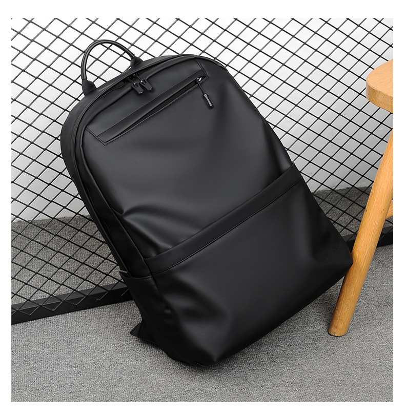 A new minimalist backpack for men, a Korean-style casual and fashionable backpack for laptops, with a logo printed on it undefined