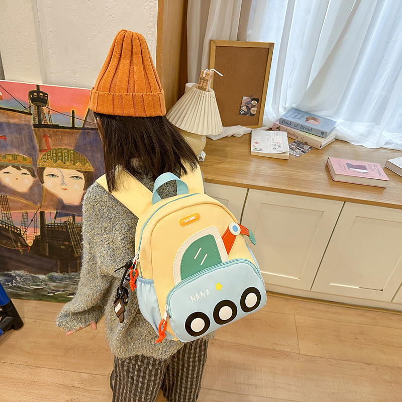 Jardín de infantes mochila escolar ligera para mujeres 2025 nueva caricatura encantadora excavadora mochila para hombres mochila de primavera