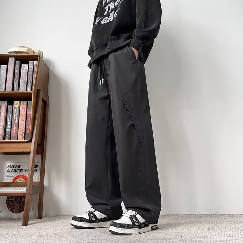 Hombres sueltos de tamaño grande comercio exterior primavera y otoño nuevos pantalones casuales de tamaño grande pantalones juveniles recto pantalones de piernas anchas transfronterizos