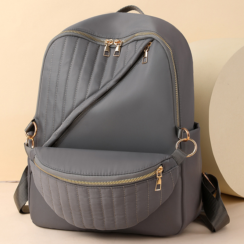 Bolsos para mujer 2024 nuevo bolso de nylon para mujer de color sólido para mujer simple y versátil mochila ligera para exteriores al por mayor