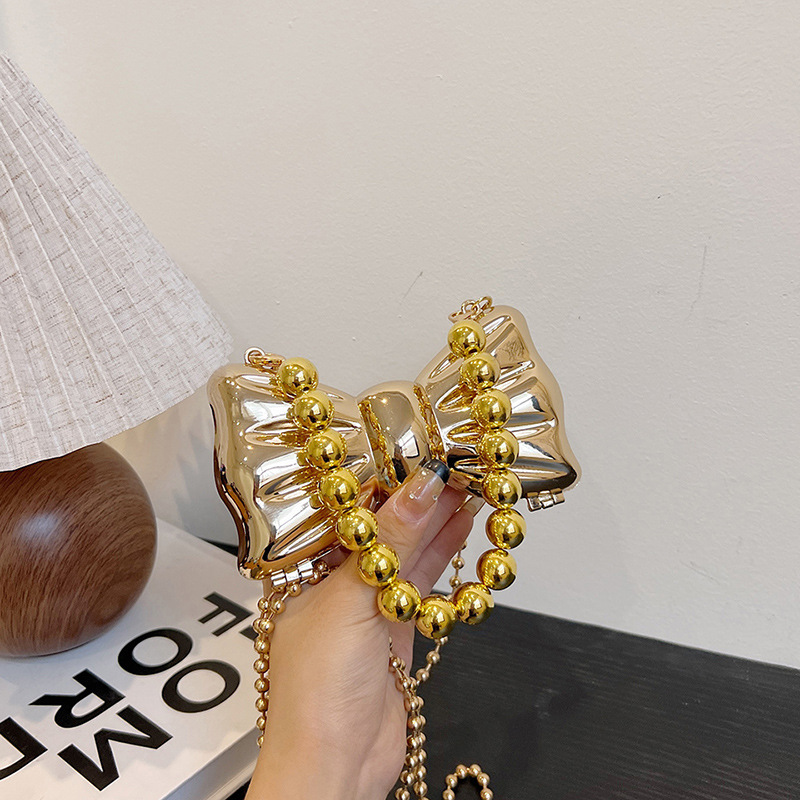Mini rossetto in metallo con fiocco alla moda per donna, borsa versatile decorativa dal design di nicchia e borsa a tracolla con catena_voghion.com