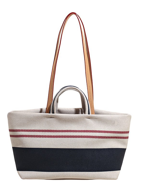 Versión coreana del bolso Tote a rayas a juego de color de gran capacidad para mujer 2025 nuevo bolso de hombro de estilo perezoso de textura occidental simple