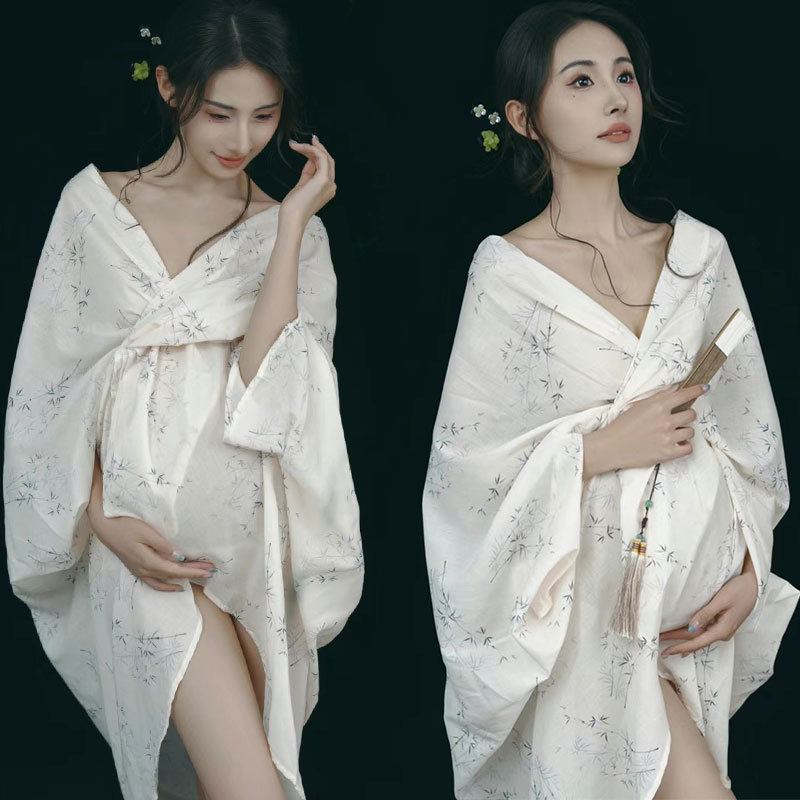 撮影のテーマの妊婦の新しい中国式の写真撮影の服装の妊娠するマミーの大きい腹は水墨画の風格を照らして長いスカートを撮影します。