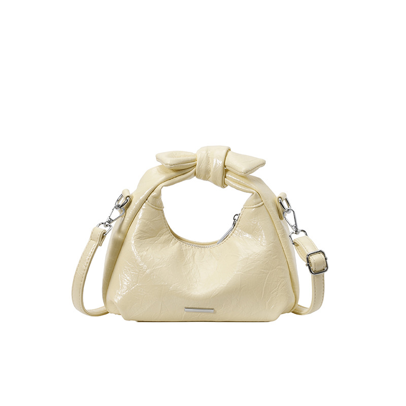 Bolsa de mano de arco para mujeres 2026 nuevo bolso de hombro de moda de verano super caliente sensación diaria mochila de viaje