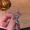 Wedding ring with bow, diamond encrusted, Japanese and Korean, on index finger