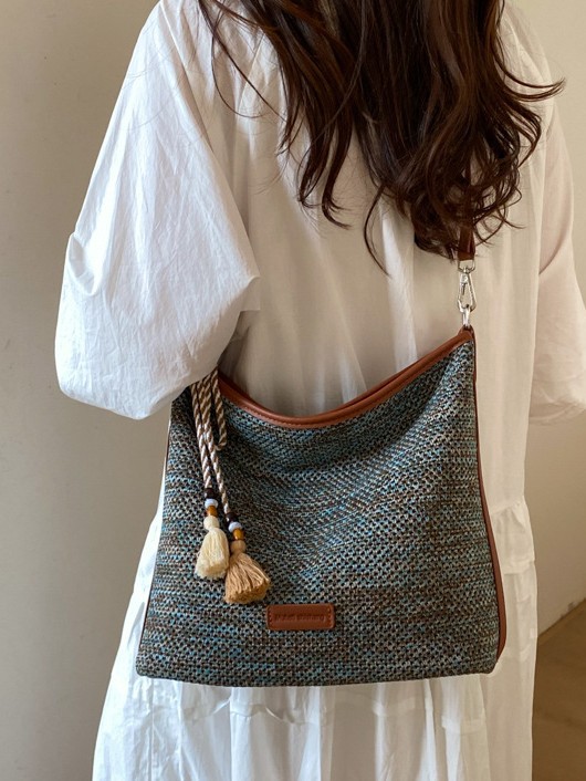 Bolsa de tote casual universal para mujeres 2026 nuevo estilo de vacaciones en la playa retro moda exquisita mochila de hombro