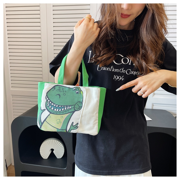 Cute cartoon printed small bag, 2024 summer new style hand-held piggy girl handbag, student storage canvas bag undefined