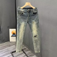 高品質の新型男性レトロ青は穴を割ってジーンズを水洗いします。