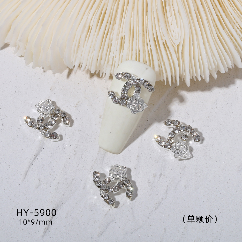 Venta caliente taladro de uñas arco de plata joyería tridimensional flash diamante esmalte de uñas decorativo diamante acabado pieza de uñas traje de joyería