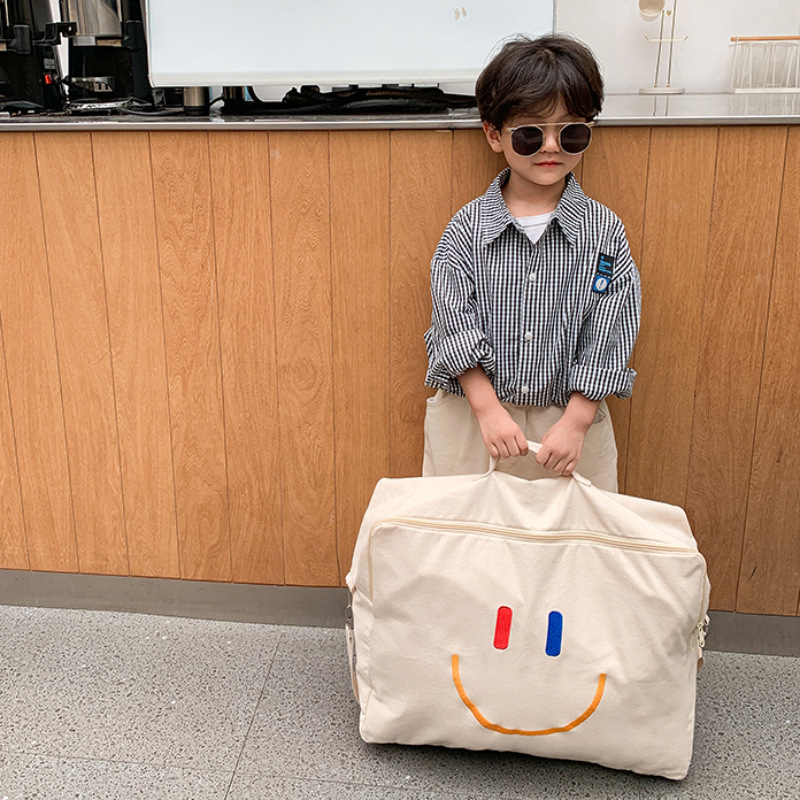 Bolsa Infantil Otoño/Invierno 2025, Nueva Bolsa con Cara Sonriente, Bolsa de Hombro de Lona de Gran Capacidad, Bolsa de Almacenamiento de Edredones Portátil para Jardín de Niños