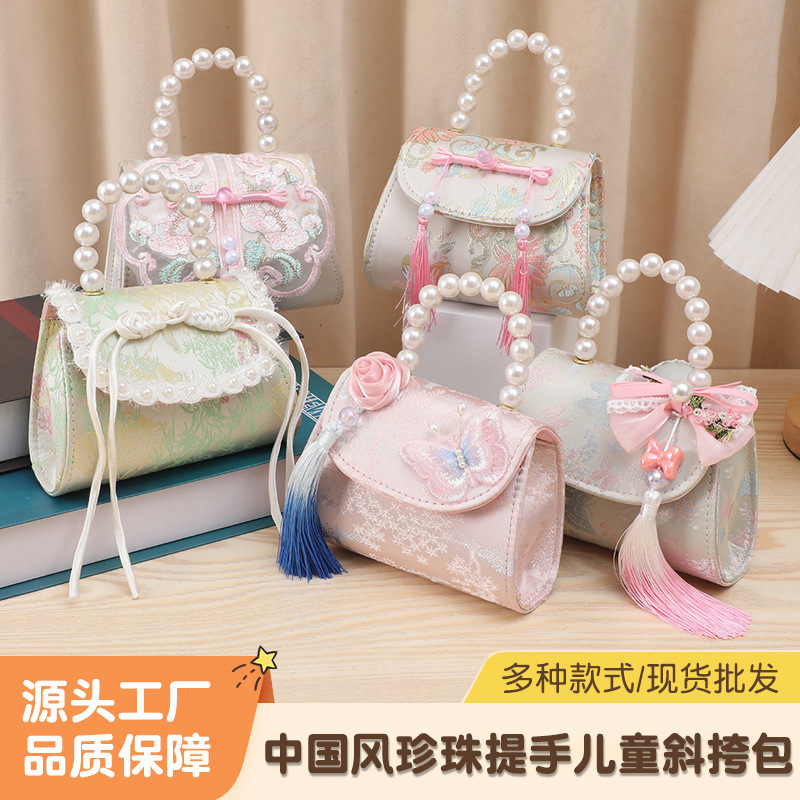 Bolsos infantiles estilo nacional arco bordilla niñas bolso princesa perla bolso de cambio portátil personalizado mini niño