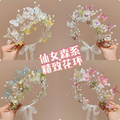 新しい子供の花の輪のカチューシャは女の子の花のカチューシャを結びます。