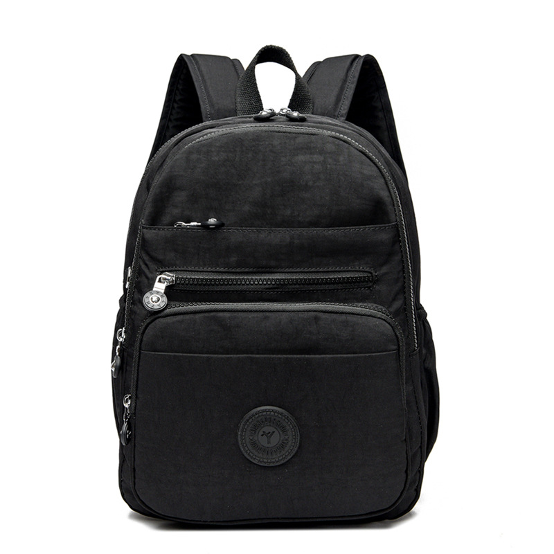 Mochila de hombro de comercio exterior 2025, nueva mochila de computadora simple de color sólido, mochila de escuela secundaria, mochila para hombres y mujeres.