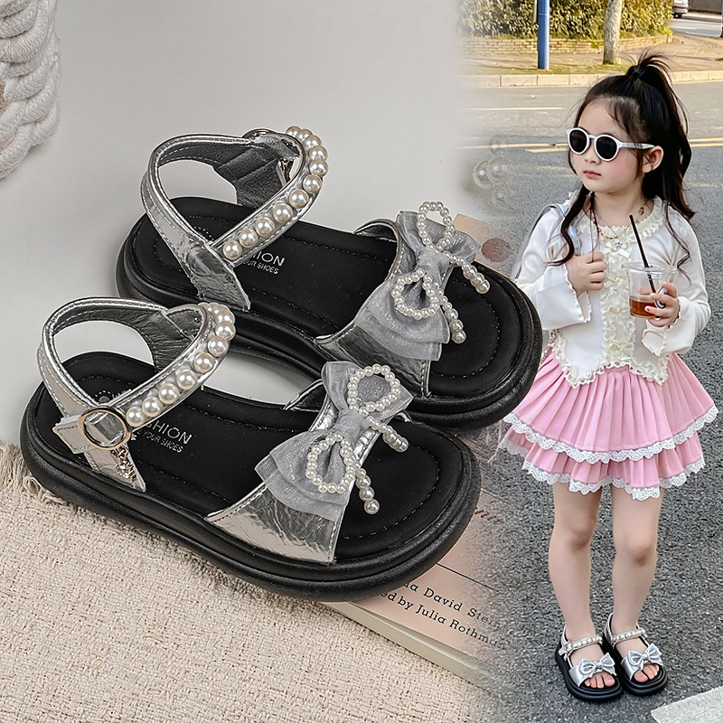 Zapatos de arco de niñas 2026 verano nuevos zapatos de princesa de estilo extranjero zapatos de moda para niñas zapatos de soleas suaves zapatos de soja