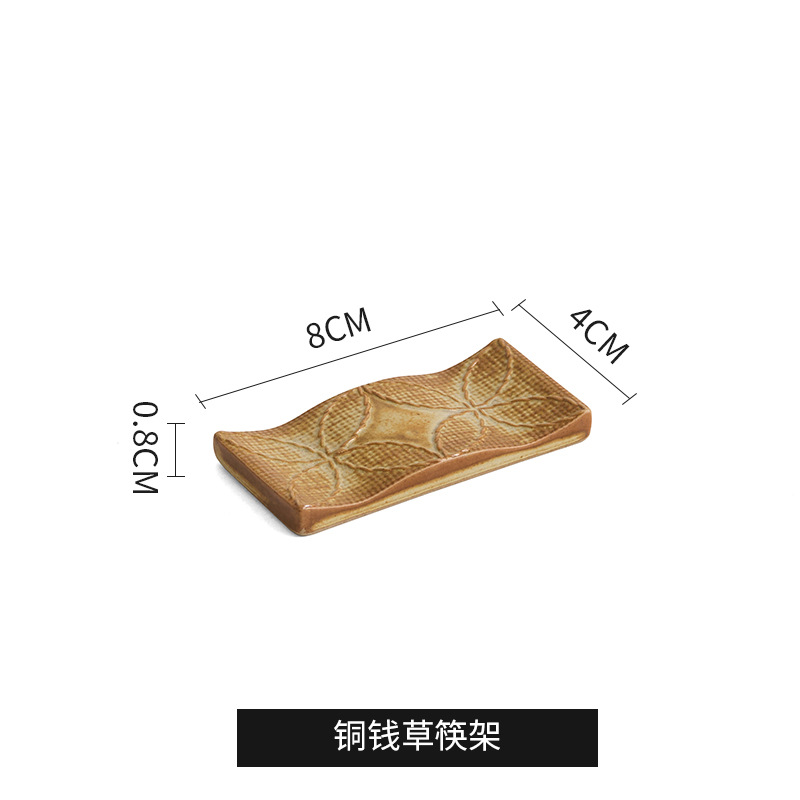 Quema de carbón - estante de palillos de cobre y hierba