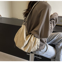 饺子包女2025夏季新款百搭休闲斜挎包大容量通勤包时尚抽绳单肩包