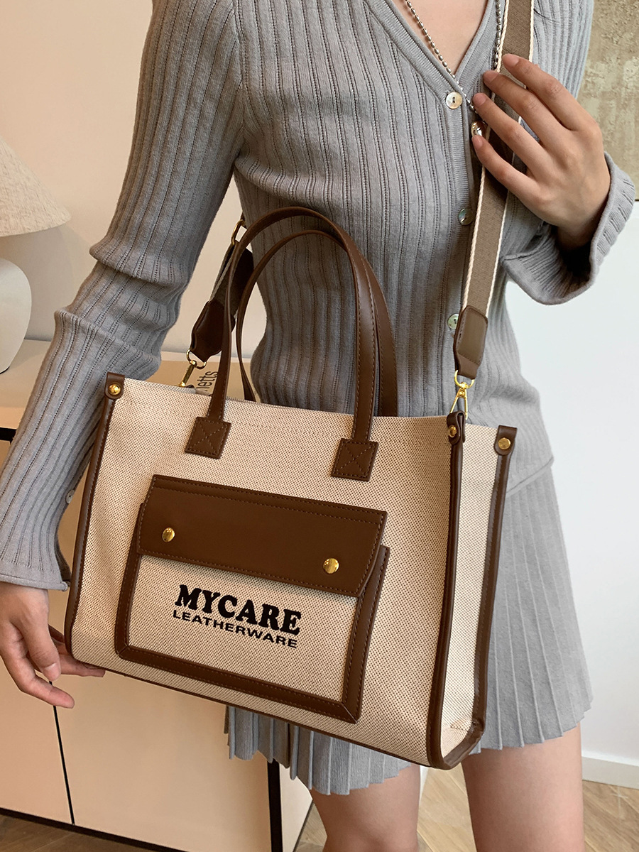 Bolso de lona de gran capacidad para mujeres 2024 nueva moda color contrastante empalme mochila de hombro simple bolsa de mano casual