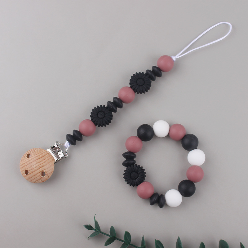Nueva margarita pequeña cadena de tetina para calmar a los bebés anti-caída cadena creativa DIY pulsera de goma de diente dos conjuntos
