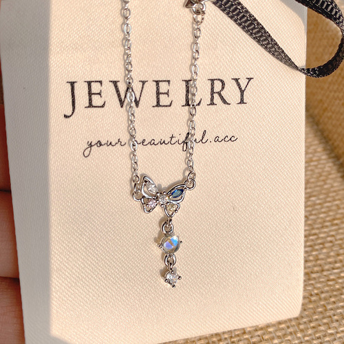 Korean-style ethereal crystal diamond butterfly necklace for women—sophisticated, niche, sweet, with moonstone accents and a trendy fringed design that’s Instagram-worthy.