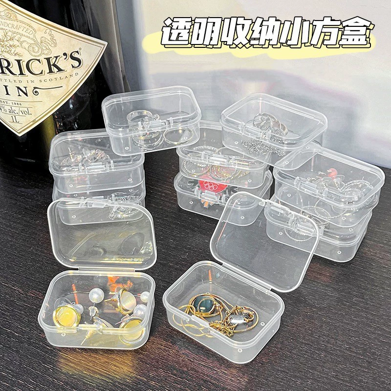Пластиковая прозрачная маленькая коробка с длинными квадратными наушными вкладышами с крышкой