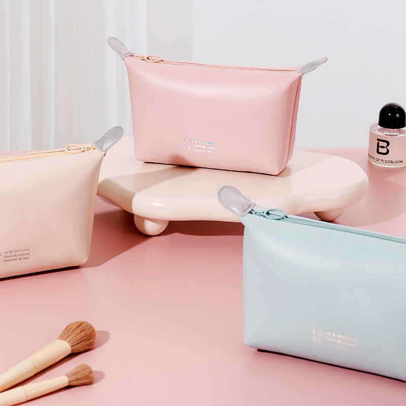 Nuevo corazón dumpling bolsa impermeable bolsa de cosméticos bolsa de lavado conveniente bolsa de almacenamiento de mano bolsa de cosméticos de color caramelo al por mayor