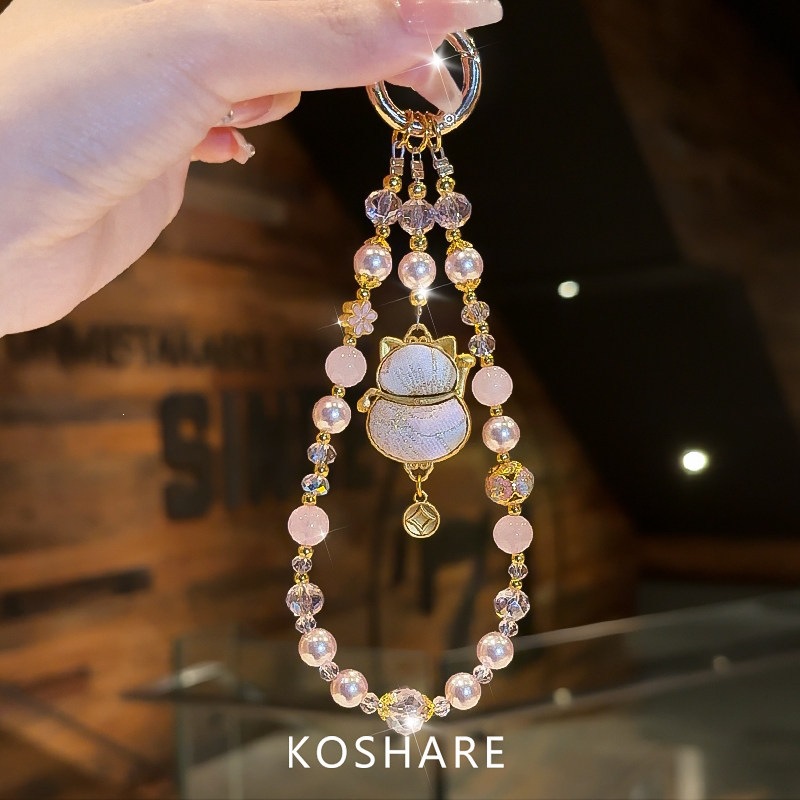 Honey Peach Cat Flash Diamond cadena de teléfonos móviles ligera de lujo nicho de alta calidad bolsos de cristal colgante colgante de mano lindos dibujos animados