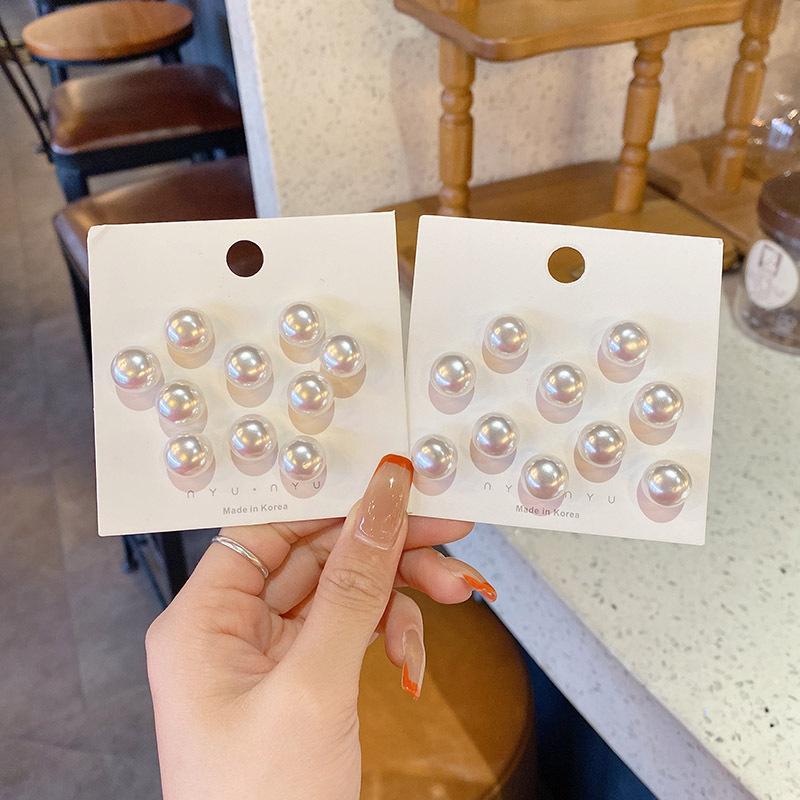 La cintura de los jeans se cambia a un botón de cintura pequeño, broche, falda de mujer, ajuste de cintura, dispositivo de ajuste, alfiler, botón anti-luz fijo