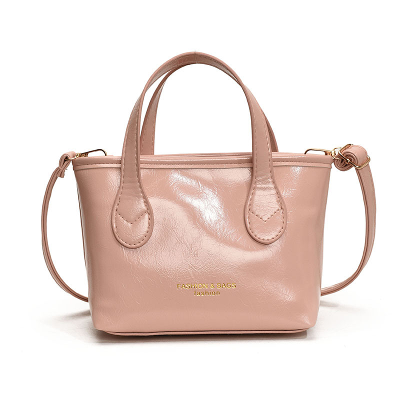 Bolso de cubo de textura de color sólido para mujer 2025 primavera nueva moda bolso de mensajero coreano estilo occidental de alta gama para mujer