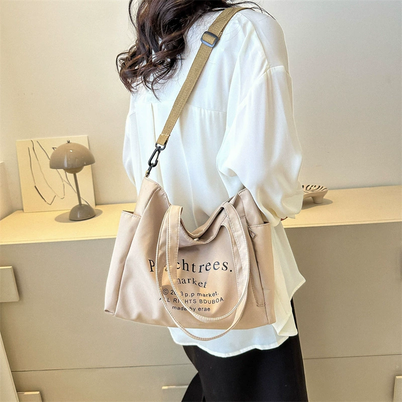 Fashionable retro one-shoulder city bag with increased thickness, available in black, white, and dark khaki