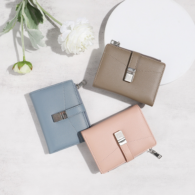 Diseño 2024 nuevo verano pequeño fresco desmagnetismo antirrobo monedero plegable bolso de tarjeta de estudiante billetera corta nicho femenino