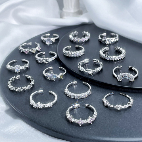 Delicate and small, minimalist open-mouthed ring with embedded zircons, unisex design, stackable and versatile fashion ring with a cool and indifferent style.