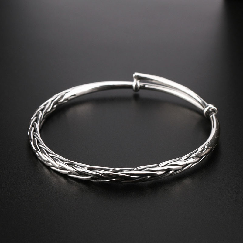 Woven silver bracelet with pigtail