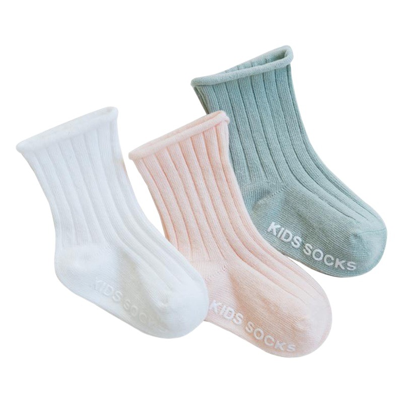 Primavera y otoño nuevos calcetines de bebé que dispensan calcetines de bebé antideslizantes doble aguja suelta color liso calcetines para niños al por mayor
