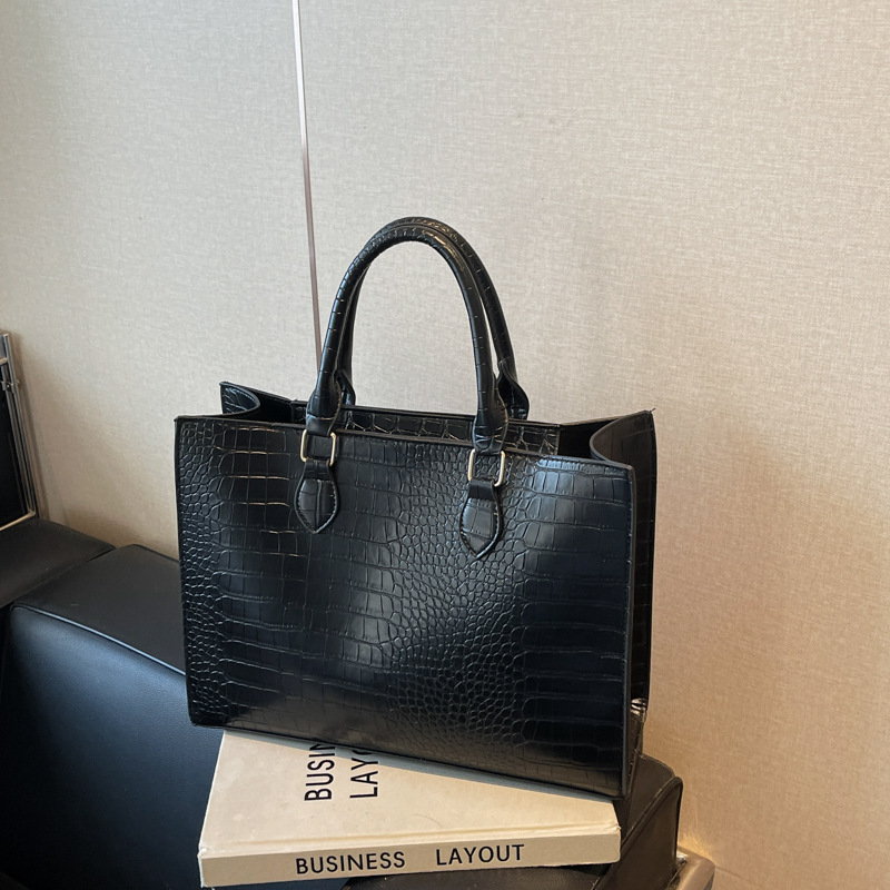 2025 primavera y verano nueva bolsa de gran capacidad temperamento simple bolso de hombro portátil mochila casual sensación de alta calidad mujer