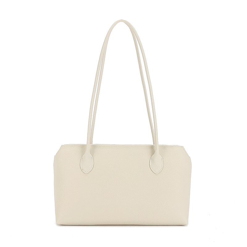 Row 2025 primavera y verano la piel es extremadamente simple, el viento está lleno de bolsos tote bolsos axilas de gran capacidad bolsos de cuero de vaca mujeres