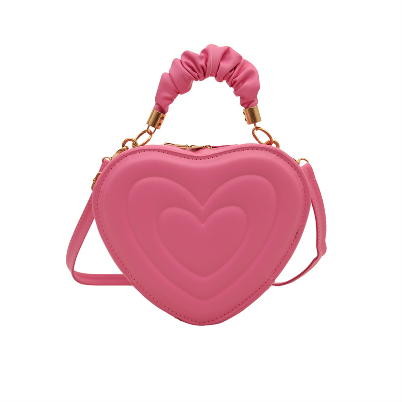 2024 otoño y invierno de mujeres nuevas caramelo de cáscara dura bolso de hombro de color corazón bolso de moda bolso de amor amor amor impresión