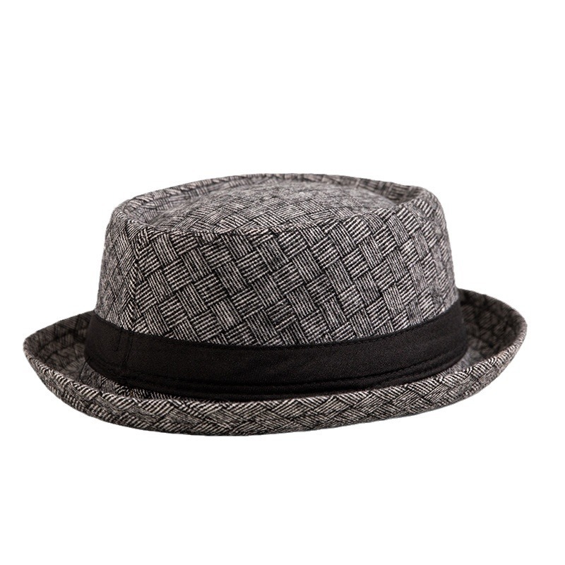 Sombrero de los hombres de primavera y verano británico europeo y americano de moda sombrero de copa a cuadros en blanco y negro a prueba de sol transpirable Jazz sombrero fábrica al por mayor