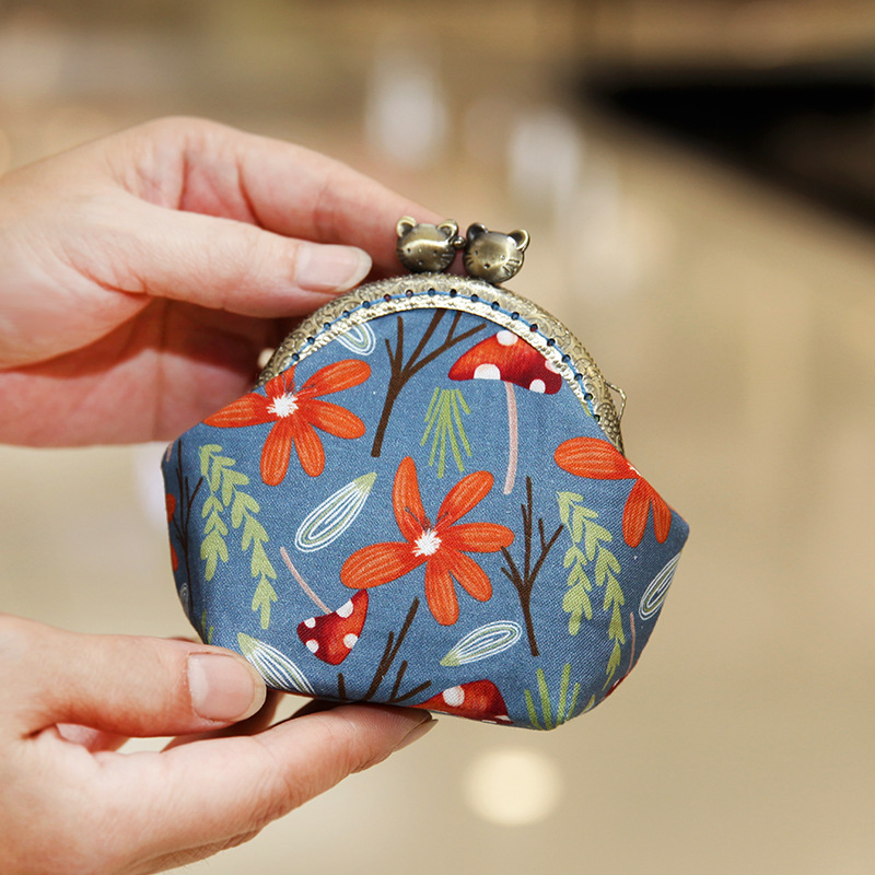 Bolsa de material de bordado bricolaje hecho a mano 8,5 boca Bolsa de Oro patchwork bolsa antigua bolsa transfronteriza inglés gato bolsa de almacenamiento