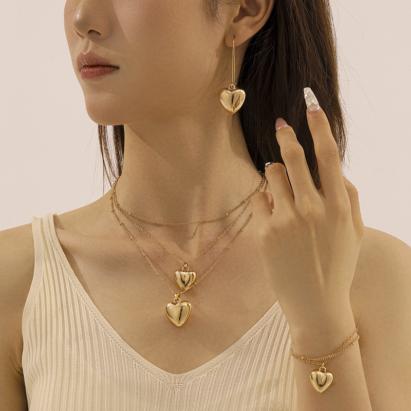 Conjunto de joyería de amor dorado simple de moda europea y americana, blogger, el mismo estilo, collar de todo fósforo, aretes, pulsera image 3