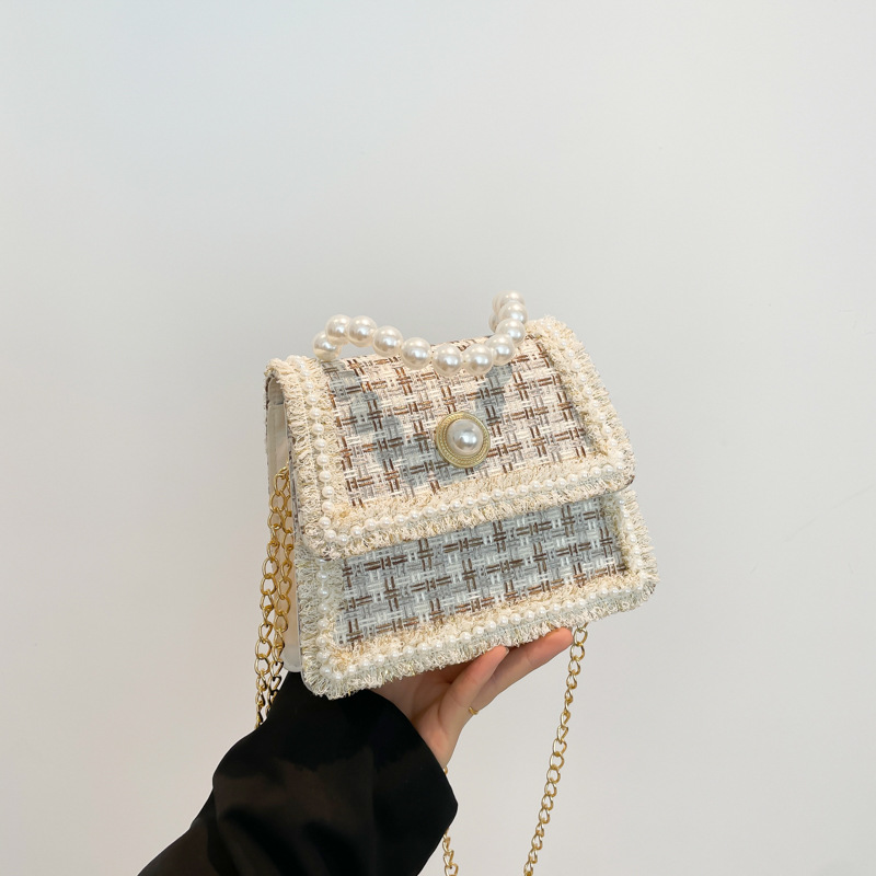 Bolso de tejido popular este año 2024 nuevo bolso pequeño de invierno para mujeres versátil nicho bolso de mochila temperamento