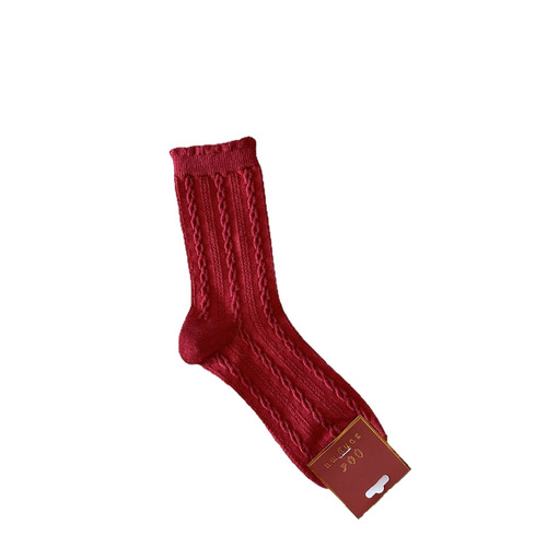 Red polka dot knee-high socks with bow ties for winter, suitable for both boys and girls, versatile and festive, perfect for autumn and winter.